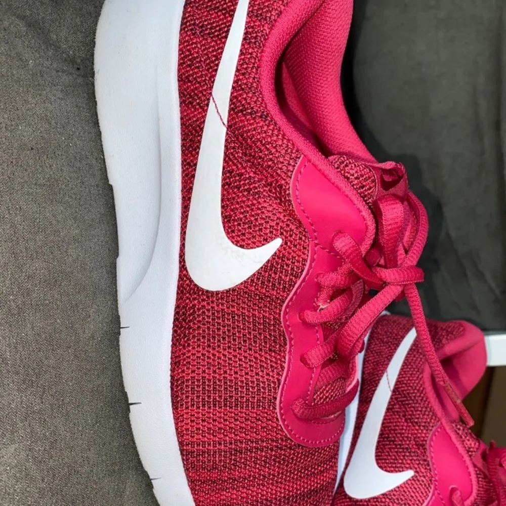 Woman’s/Youth hot pink Nike sneakers